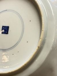 Eleven Chinese blue and white gadrooned 'Flowers and Peacocks' plates, Kangxi