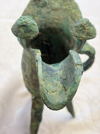 A Chinese archaic bronze wine vessel with Taotie design, Jue 爵, late Shang