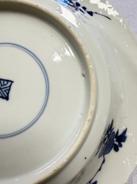 Eleven Chinese blue and white gadrooned 'Flowers and Peacocks' plates, Kangxi