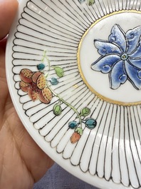 A Chinese famille rose cup and saucer with floral design, Yongzheng