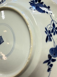 Eleven Chinese blue and white gadrooned 'Flowers and Peacocks' plates, Kangxi
