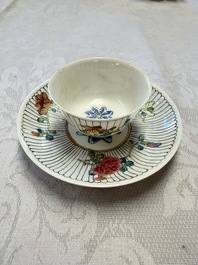 A Chinese famille rose cup and saucer with floral design, Yongzheng