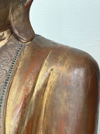 A very large Burmese mica-inlaid gilt-lacquered wooden Mandaly Buddha, 20th C.