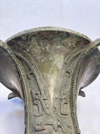 A Chinese archaic bronze wine vessel with Taotie design, Zun 尊, late Shang