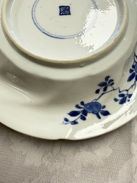 Eleven Chinese blue and white gadrooned 'Flowers and Peacocks' plates, Kangxi