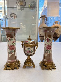 A pair of gilt-bronze-mounted Chinese famille rose capucine-ground vases and a covered bowl, Qianlong
