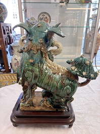 A pair of large Chinese polychrome-glazed Shiwan stoneware Buddhist lions, 19th C.