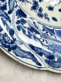 Eleven Chinese blue and white gadrooned 'Flowers and Peacocks' plates, Kangxi