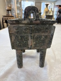 An inscribed Chinese archaic bronze food vessel with Taotie design, Ding 鼎, Western Zhou