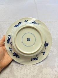 Eleven Chinese blue and white gadrooned 'Flowers and Peacocks' plates, Kangxi
