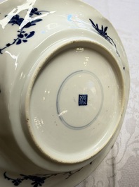 Eleven Chinese blue and white gadrooned 'Flowers and Peacocks' plates, Kangxi