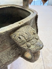 A Chinese archaic bronze wine vessel with owl design, Jia 斝, late Shang