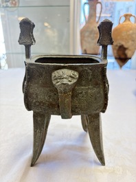 A Chinese archaic bronze wine vessel with owl design, Jia 斝, late Shang