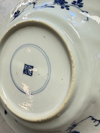 Eleven Chinese blue and white gadrooned 'Flowers and Peacocks' plates, Kangxi