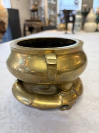 A fine Chinese bronze tripod censer and stand, Xuande mark, 17/18th C.