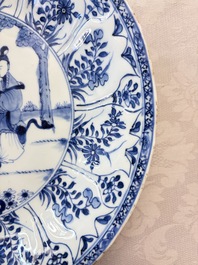 A pair of Chinese blue and white moulded dishes with dancing ladies, Kangxi