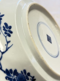 Eleven Chinese blue and white gadrooned 'Flowers and Peacocks' plates, Kangxi
