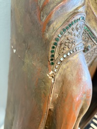 A very large Burmese mica-inlaid gilt-lacquered wooden Mandaly Buddha, 20th C.