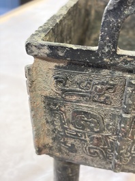 An inscribed Chinese archaic bronze food vessel with Taotie design, Ding 鼎, Western Zhou