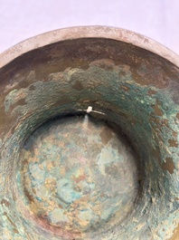 A Chinese archaic bronze wine vessel with Taotie design, Zun 尊, late Shang