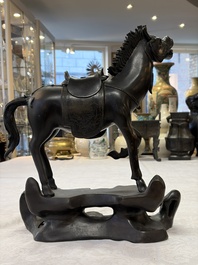 A large Chinese bronze horse-shaped incense burner and cover, 17/18th C.