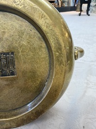 A fine Chinese bronze censer with loop handles and stand, Xuande mark, 18th C.