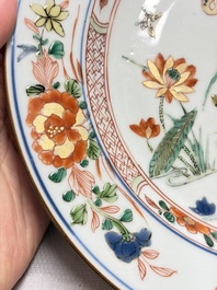 Three Chinese famille verte plates with floral design, one powder-blue-ground, Kangxi