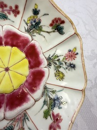 A rare Chinese famille rose moulded cup and saucer with floral design, Yongzheng