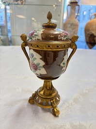 A pair of gilt-bronze-mounted Chinese famille rose capucine-ground vases and a covered bowl, Qianlong