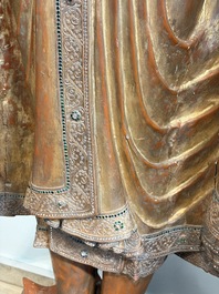 A very large Burmese mica-inlaid gilt-lacquered wooden Mandaly Buddha, 20th C.
