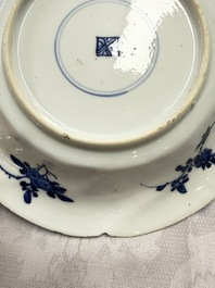 Eleven Chinese blue and white gadrooned 'Flowers and Peacocks' plates, Kangxi