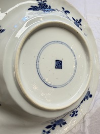 Eleven Chinese blue and white gadrooned 'Flowers and Peacocks' plates, Kangxi