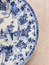 A pair of Chinese blue and white moulded dishes with dancing ladies, Kangxi