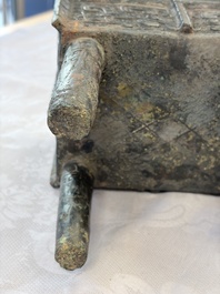 An inscribed Chinese archaic bronze food vessel with Taotie design, Ding 鼎, Western Zhou