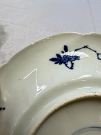Eleven Chinese blue and white gadrooned 'Flowers and Peacocks' plates, Kangxi