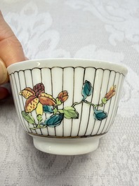 A Chinese famille rose cup and saucer with floral design, Yongzheng