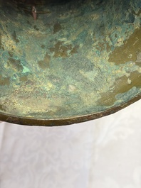 A Chinese archaic bronze wine vessel with Taotie design, Zun 尊, late Shang