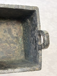 An inscribed Chinese archaic bronze food vessel with Taotie design, Ding 鼎, Western Zhou