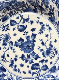 Eleven Chinese blue and white gadrooned 'Flowers and Peacocks' plates, Kangxi