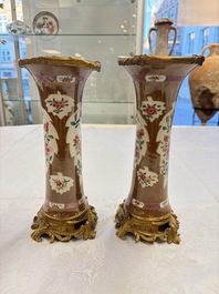 A pair of gilt-bronze-mounted Chinese famille rose capucine-ground vases and a covered bowl, Qianlong