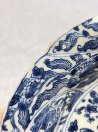 Eleven Chinese blue and white gadrooned 'Flowers and Peacocks' plates, Kangxi