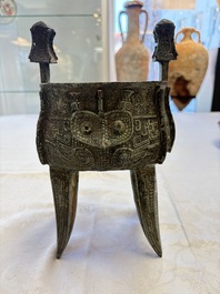 A Chinese archaic bronze wine vessel with owl design, Jia 斝, late Shang