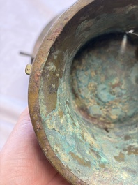 A Chinese archaic bronze wine vessel with Taotie design, Zun 尊, late Shang