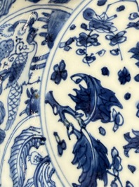 Eleven Chinese blue and white gadrooned 'Flowers and Peacocks' plates, Kangxi