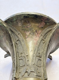 A Chinese archaic bronze wine vessel with Taotie design, Zun 尊, late Shang
