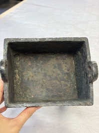 An inscribed Chinese archaic bronze food vessel with Taotie design, Ding 鼎, Western Zhou