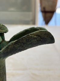 A Chinese archaic bronze wine vessel with Taotie design, Jue 爵, late Shang