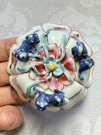 A rare Chinese famille rose moulded cup and saucer with floral design, Yongzheng