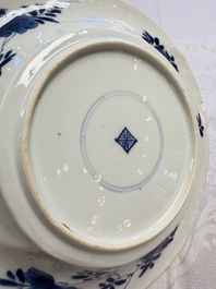 Eleven Chinese blue and white gadrooned 'Flowers and Peacocks' plates, Kangxi