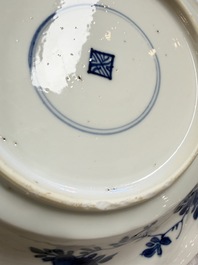 Eleven Chinese blue and white gadrooned 'Flowers and Peacocks' plates, Kangxi